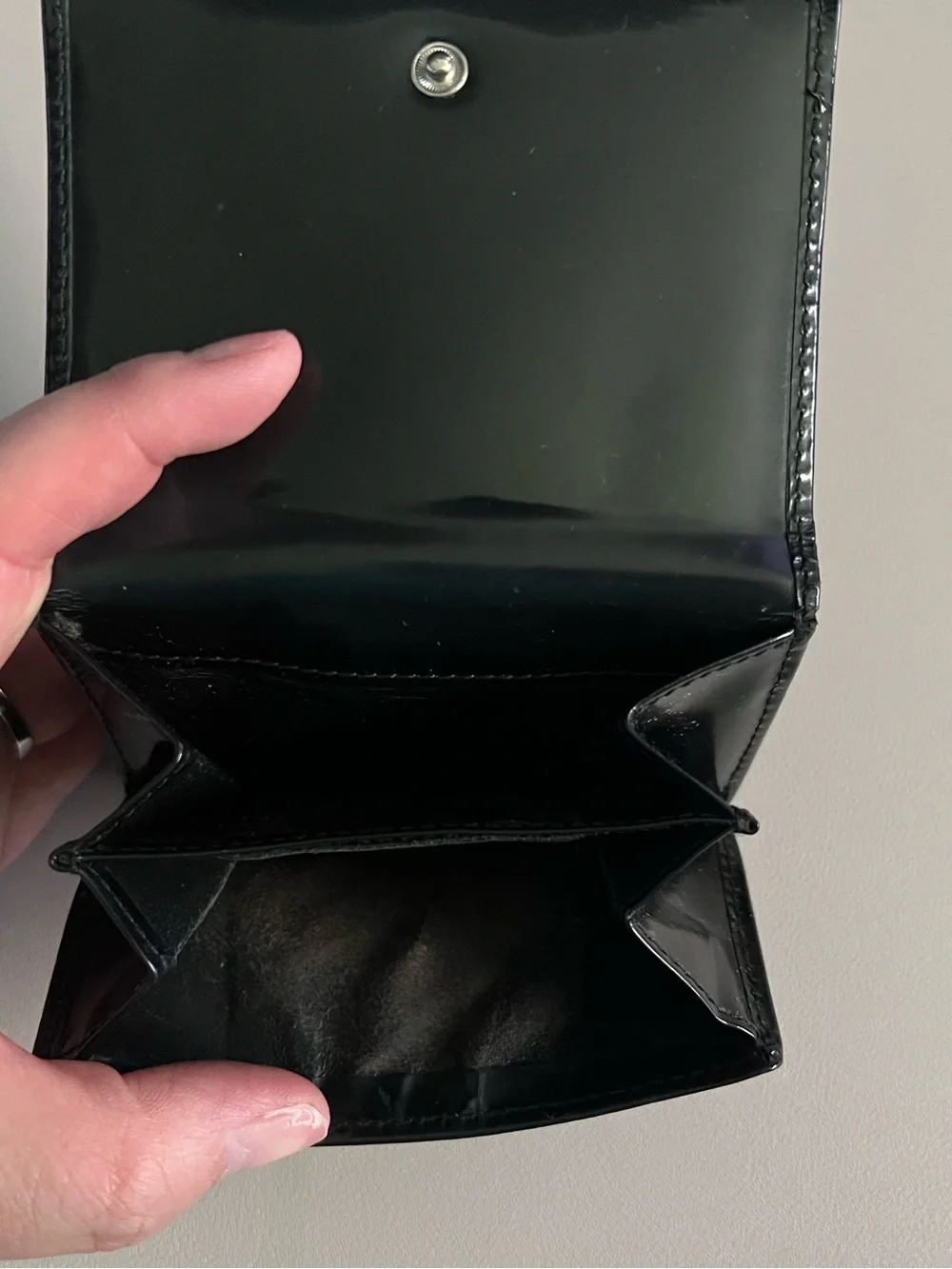 Gucci Black Patent Leather Bi-Fold Wallet with Embossed G